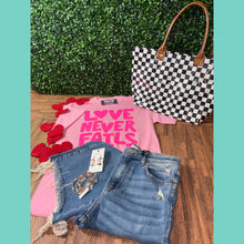 Love Never Fails Graphic Tee